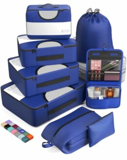 Blue travel packing cube set with various sizes and a toiletry bag.