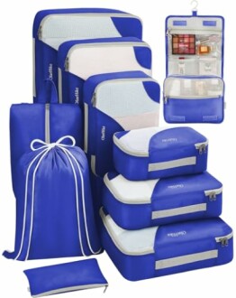 Blue travel packing cubes set with various sizes and a hanging toiletry bag.