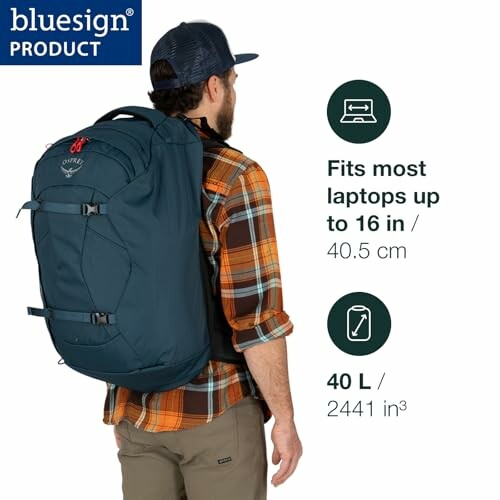 Man wearing a blue Osprey backpack suitable for laptops up to 16 inches and 40 liters capacity.